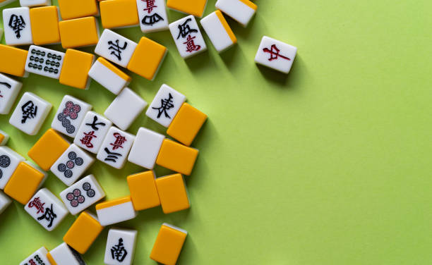 istock Mahjong tiles lined up on a green background 2183016382