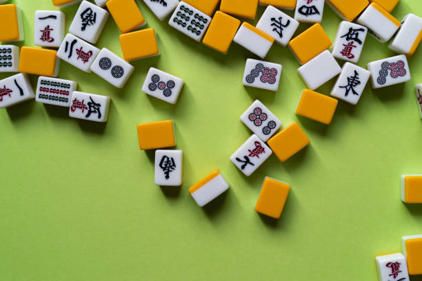 istock Mahjong tiles lined up on a green background 2183016399