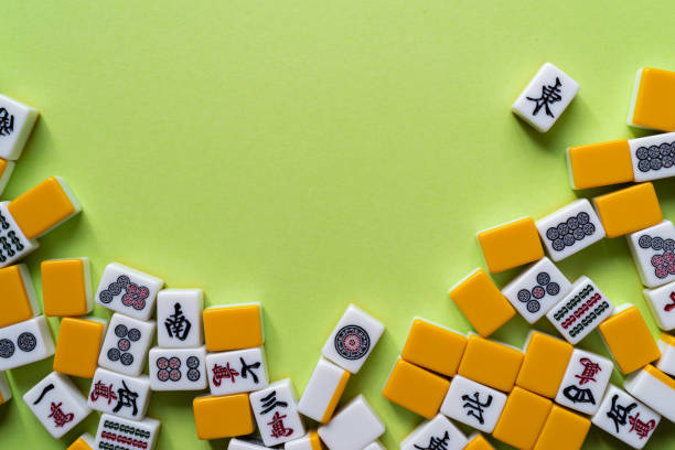 istock Mahjong tiles lined up on a green background 2183016409