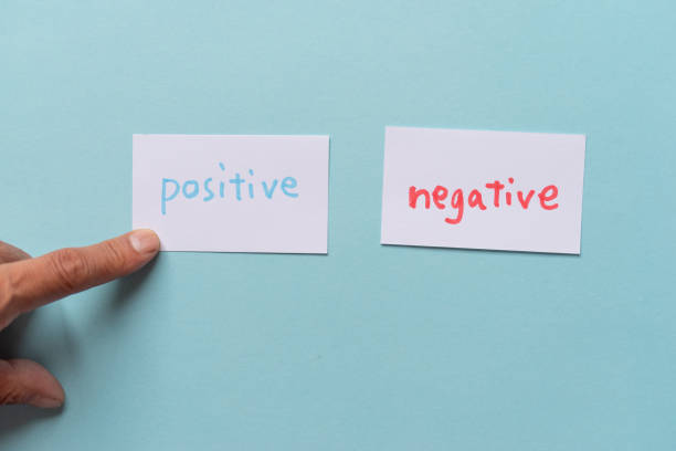 istock People who have negative and positive cards 2183017011