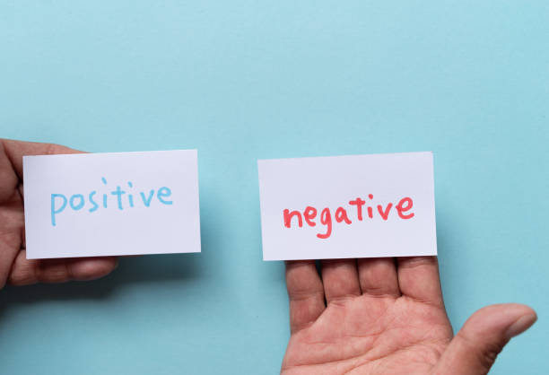 istock People who have negative and positive cards 2183017033