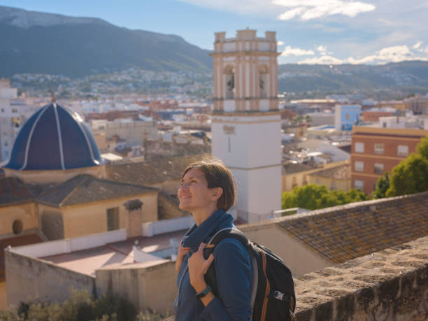 istock Young woman exploring historic castle in Denia 2183020863