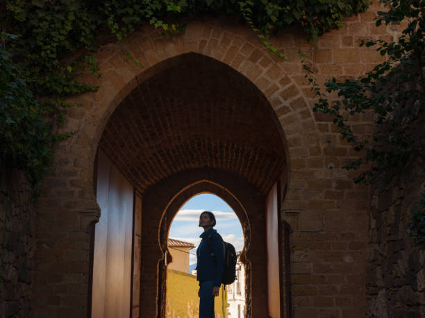 istock Young woman exploring historic castle in Denia 2183021552