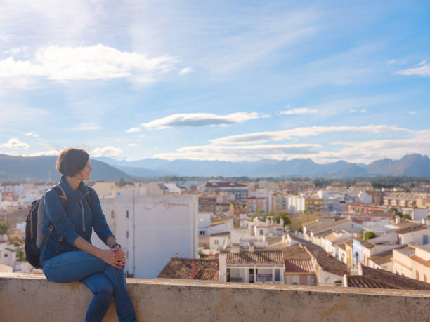 istock Young woman exploring historic castle in Denia 2183021750