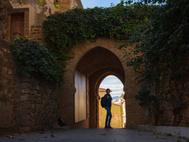 istock Young woman exploring historic castle in Denia 2183021829
