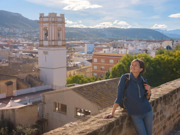 istock Young woman exploring historic castle in Denia 2183023483