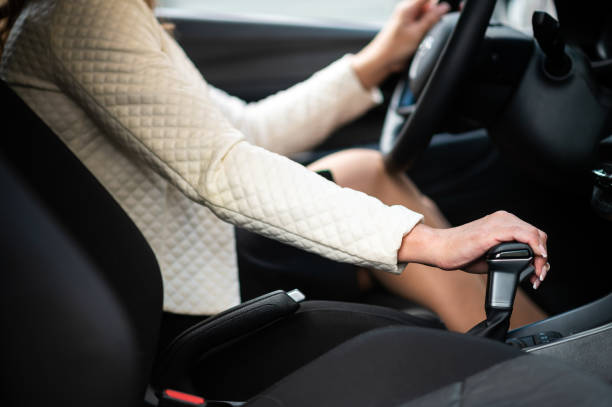istock Businesswoman shifting gears while driving modern car 2183023932
