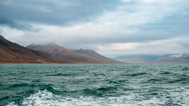 istock Majestic Svalbard landscape showcasing ocean waves and rugged mountains under cloudy sky 2183032867