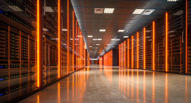 istock Server room with orange lights reflecting on the floor 2183037636