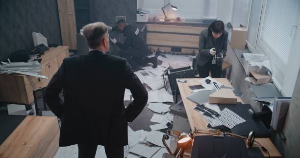 istock Office robbery case: High angle of crime investigation team working 2183040441