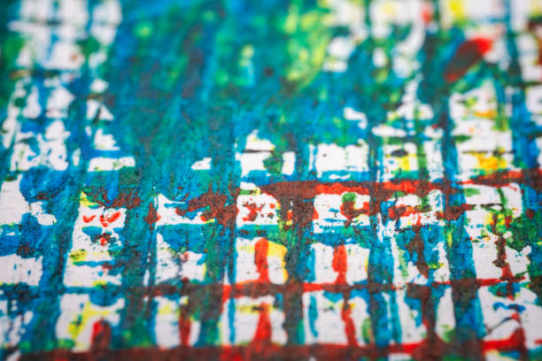 Extreme close up of colorful acrylic paint texture showing brush strokes. Selective focus.