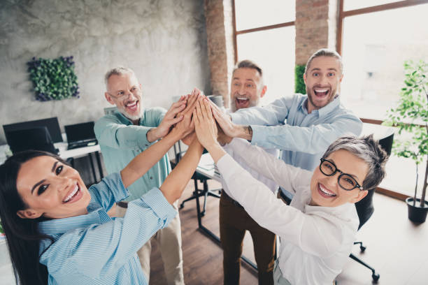istock Photo of coworking project teamwork people highfive support excited work together conference meeting successful nice light office 2183049741