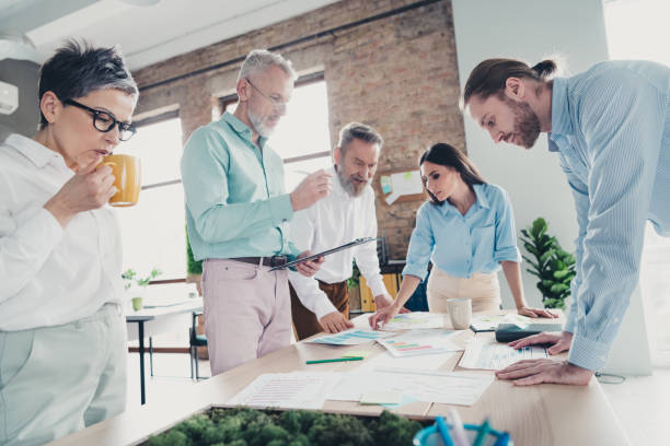 istock Photo of teamwork startup partners working together brainstorm comfortable nice creative startup office loft room interior 2183050005
