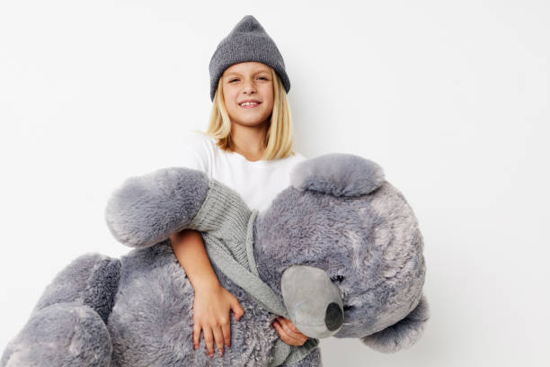 istock emotional girl with teddy bear a toy on a light background 2183050973