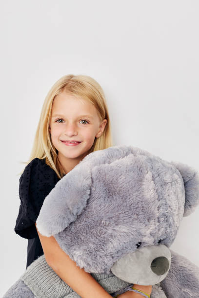 istock happy child in a black t-shirt grimace on a light background 2183051101