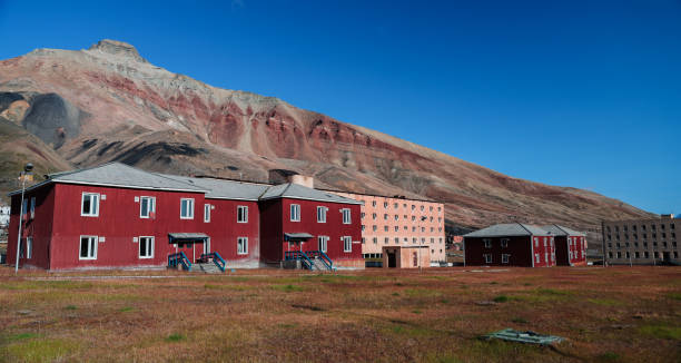 istock Exploring the abandoned buildings of Pyramiden in Svalbard under a clear blue sky 2183051297