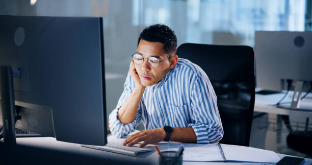 istock Burnout, computer and deadline with business man in office at night for overtime administration. Exhausted, fatigue and sleeping with tired employee at desk in workplace for late evening report 2183051977