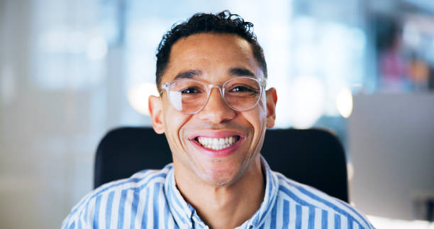 istock Business man, portrait and smile in office with confidence from programming job at tech agency. Happy, professional and programmer at desk with glasses at data mining startup with positive employee 2183052013