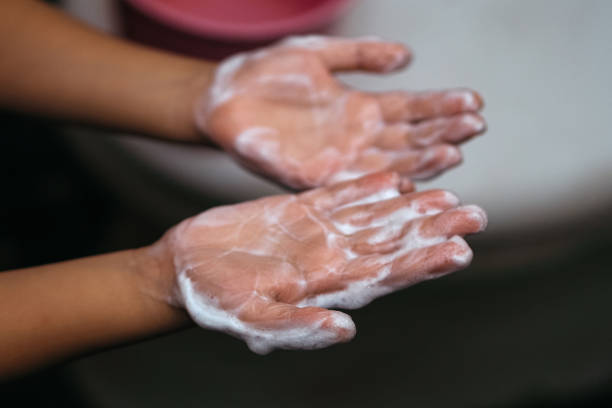 close up of child's hand with soap foam