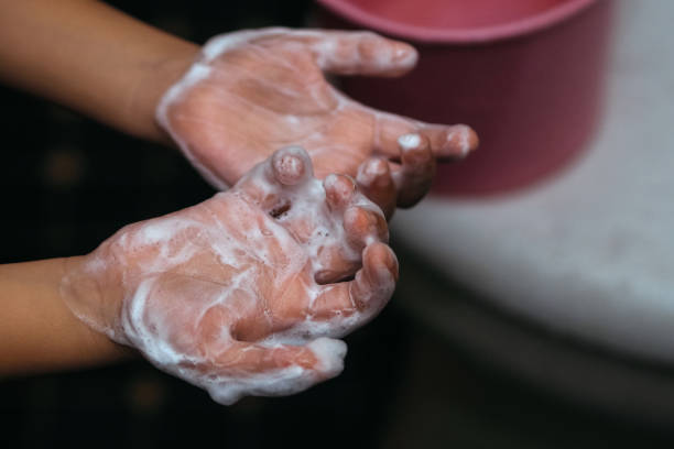 istock close up of child's hand with soap foam 2183053272