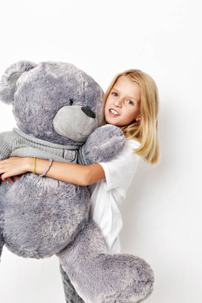 istock happy cute girl in a white t-shirt grimace posing studio 2183053705