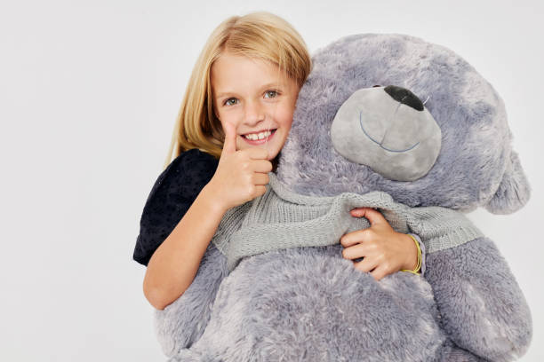 istock Little cute girl fun teddy bear joy isolated background 2183054521