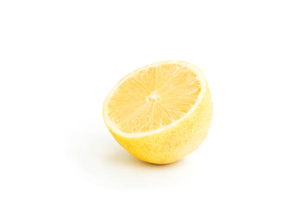 Lemon isolated on white background. Lemon fruits with a slice. Fresh lemon fruits with citrus leaves. Lemon juice. Pattern. Space for text.
