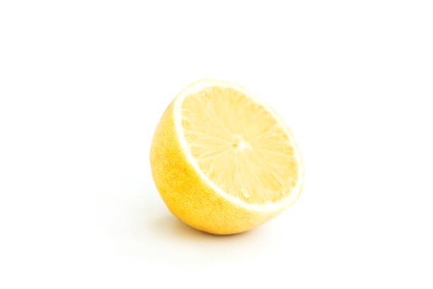 Close-Up Of Lemon Against White Background