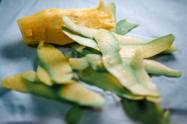 Mangos and cucumbers piled in a decorative way at a market stall at the famous food market in Berastagi in North Sumatra