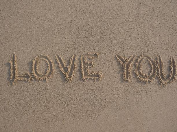 I love you written on the beach sand