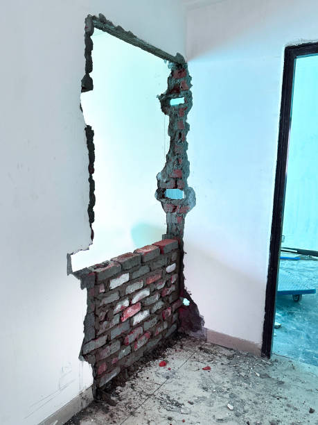 istock Image of blocking up a doorway with bricks and plaster / home building, interior design transformations, construction, renovation 2183063159