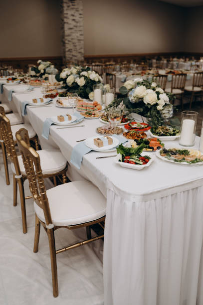 istock A banquet table in white and gold colors. 2183066732