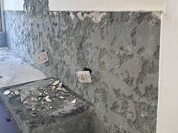 istock Image of knocking tiles off kitchen wall, renovation / transforming interior design with demolition work / modern kitchen remodel 2183067715