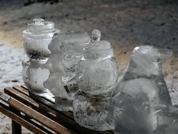Ice figures on a bench in a park in winter