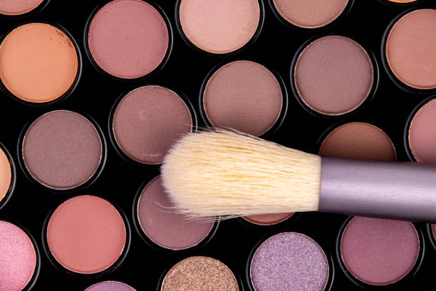 istock Colorful eyeshadow palette with a brush ready for makeup application in a well-lit setting 2183076435
