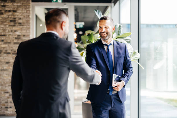 istock Business handshake greeting in a bright office 2183079087