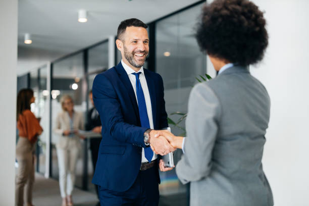 istock Business handshake between professionals in an office 2183079152