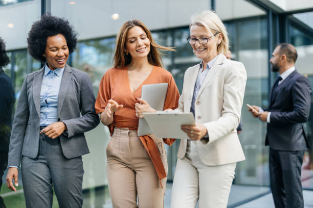 istock Colleagues with tablet sharing a cheerful moment 2183079153