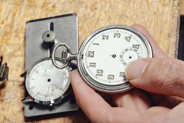 Watch collector holding his chain watch, close up