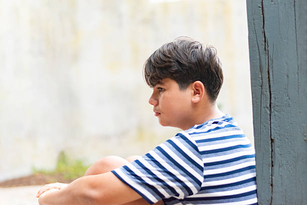 istock Asian boy with bad emotion in detention center. 2183082606