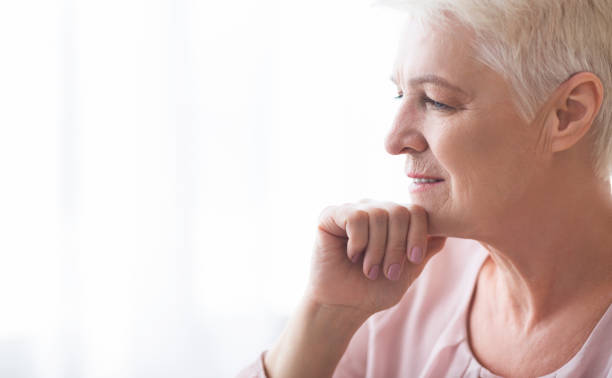 istock Side shot of pensive senior lady looking aside 2183082959