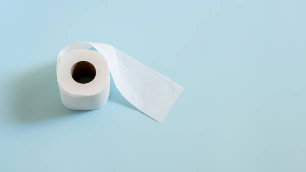 istock Top view of toilet paper roll on blue background 2183083484