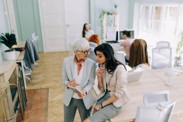 istock Two businesswoman talking at modern office 2183087249