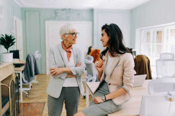 istock Two businesswoman talking at modern office 2183087271