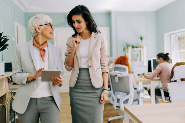 istock Two businesswoman talking at modern office 2183087563