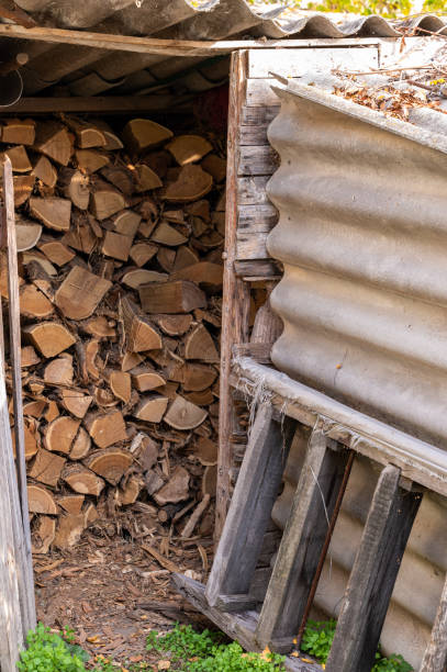 istock Firewood stack in a rustic outdoor wood shed 2183088912