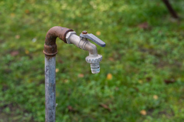 A gasoline pump handle isolated on a white background