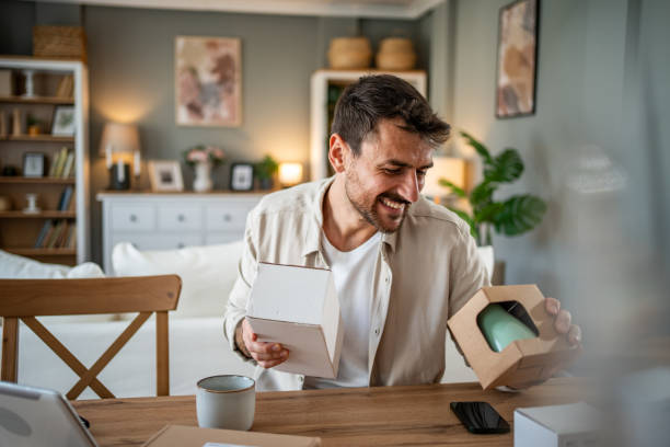 istock Happy young man with a package in his hands, ready to open his online order 2183089414