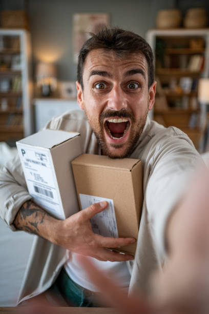 istock The young man enjoys a selfie with his new online orders 2183089575