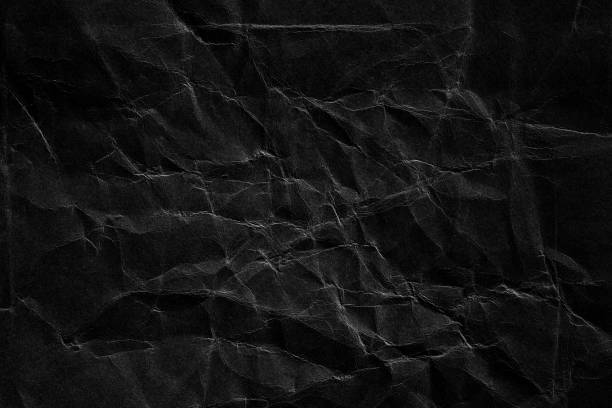 istock black crumpled paper texture with fold crease 2183089905